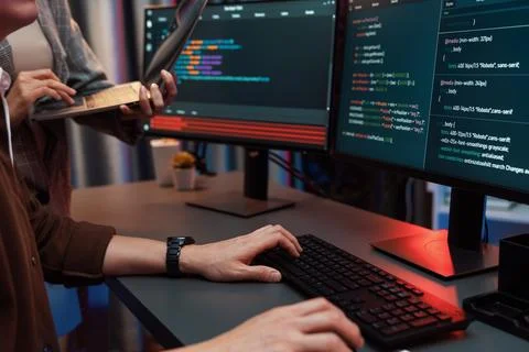 IT developers discussing intelligent website with laptop showing data. Infobahn. Stock Photos