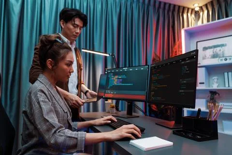 IT developers discussing intelligent website with laptop showing data. Infobahn. Stock Photos