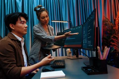 IT developers discussing intelligent website with laptop showing data. Infobahn. Stock Photos