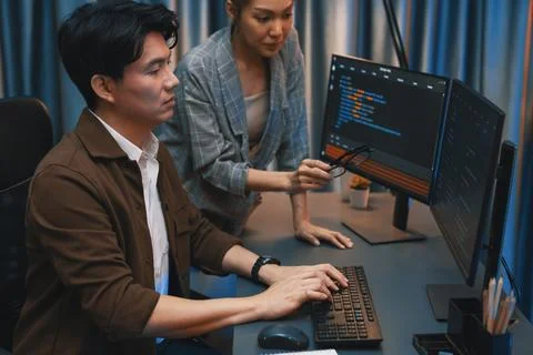 IT developers discussing with point website coding system. Infobahn. Stock Photos