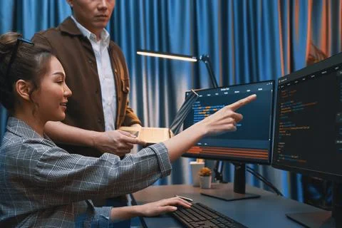 IT developers discussing with point website coding system. Infobahn. Stock Photos