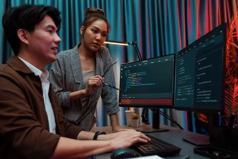 IT developers discussing with point website coding system. Infobahn. Stock Photos