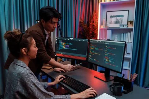 IT developers discussing with point website coding system. Infobahn. Stock Photos