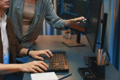 IT developers discussing with point website coding system. Infobahn. Stock Photos