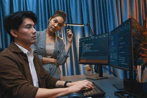 IT developers discussing with point website coding system. Infobahn. Stock Photos