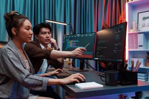 IT developers discussing with point website coding system. Infobahn. Stock Photos