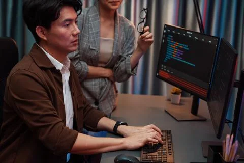 IT developers discussing with point website coding system. Infobahn. Stock Photos