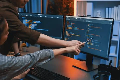 IT developers discussing with point website coding system. Infobahn. Stock Photos