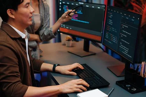 IT developers discussing with point website coding system. Infobahn. Stock Photos