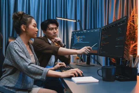 IT developers discussing with point website coding system. Infobahn. Stock Photos