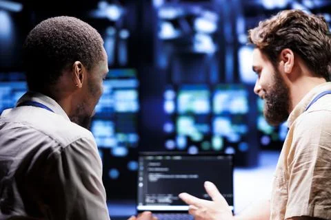 IT Developers writing data center code Stock Photos