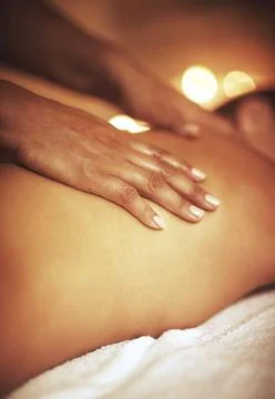 It doesnt get anymore relaxing...a woman enjoying a back massage at a spa. Stock Photos