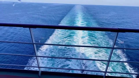 It is drizzling outside the window of the ship. Sea liner foaming wake Stock Footage 253764134
