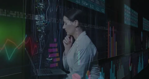 IT engineer analyzing data in server room, with animated line charts and cable Stock Footage 307440948