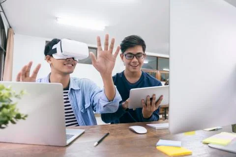 IT engineer and programmer testing software and working with VR headset on. Stock Photos
