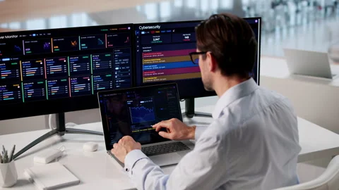 IT Engineer Carefully Monitors Network Performance Using Multiple Tools Stock Footage 334537524