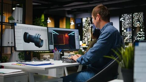 IT engineer checks AI game lobby and turbine to develop a new application Stock Photos