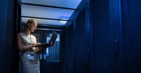 IT engineer   doing routine maintenance server rack Stock Photos