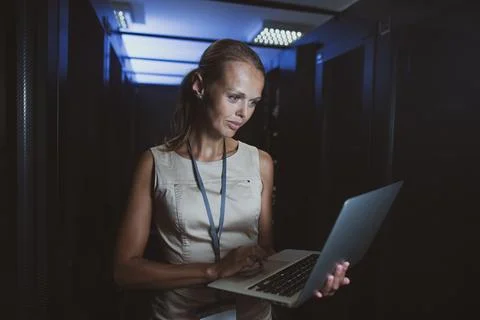 IT engineer   doing routine maintenance server rack Stock Photos
