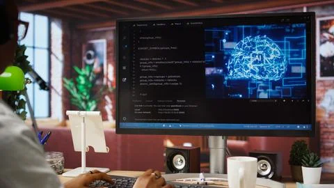 IT engineer drinking coffee, using computer at home for AI computing 写真素材