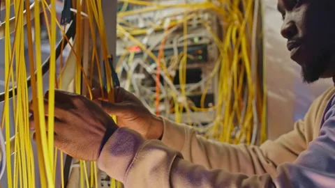 IT Engineer Fixing Cables of Network Panel in Server Room Stockbeeldmateriaal 232625598