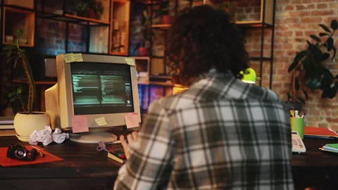 IT engineer getting error message while debugging computer code, 90s lifestyle 動画素材 315457126