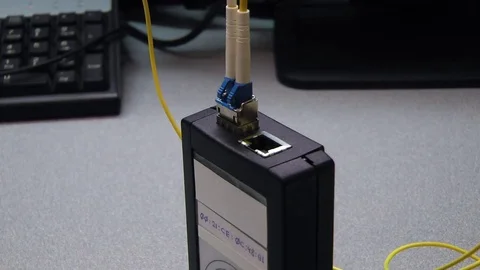 IT engineer insert cooper patch cord in tested device. Video stock 83018116
