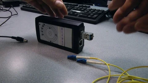 IT engineer insert optical patch cord in tested device. Video stock 83017807