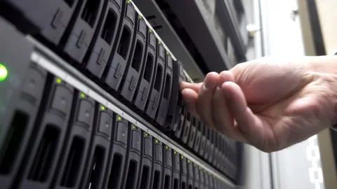 IT Engineer install hard drive in server rack. Cluster Server Data Room. Stock Footage 100706687