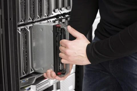 It engineer installs blade server in data center Stock Photos