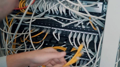 IT Engineer Male Patching Network Equipment In Server Room. Video stock 103212690