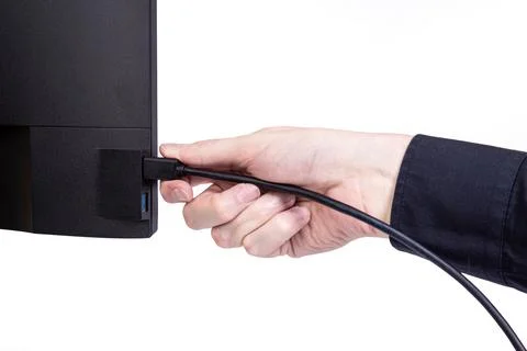 IT engineer Man hand inserts cable into monitor. Man hand connecting the DVI Stock Photos