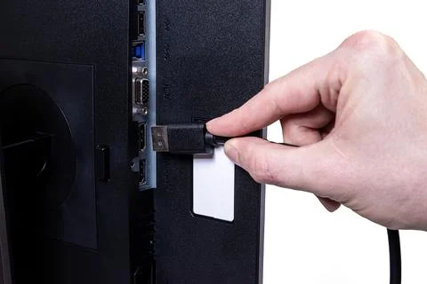 IT engineer Man hand inserts cable into monitor. Man hand connecting the DVI Stock Photos