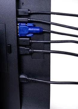 IT engineer Man hand inserts cable into monitor. Man hand connecting the DVI Stock Photos