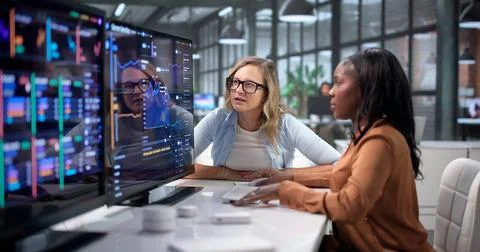 IT Engineer Monitors Real-time Server Performance And System Uptime Closely. Stock Photos