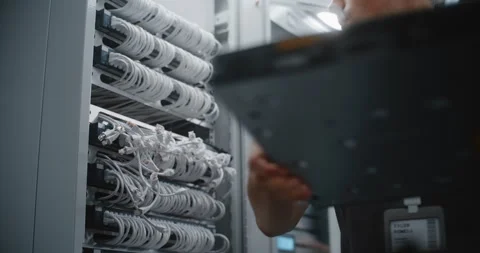 IT Engineer Mounting Replacement Network Switch on 19 Inch Server Rack 動画素材 344972288
