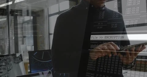 IT engineer moving into desk and tapping tablet, running File  ENCRYPTION Stock Footage 331872497