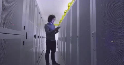 IT engineer or data science specialist working on tablet computer in server room Vídeos de archivo 219487190