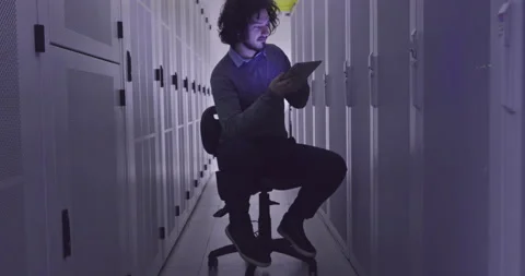 IT engineer or data science specialist working on tablet computer in server room Vídeos de archivo 219543048