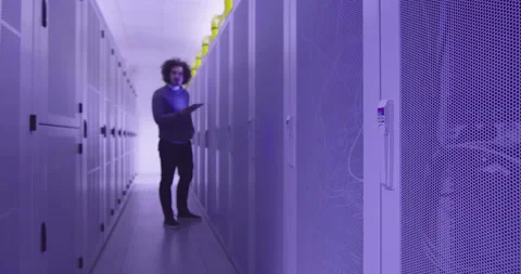 IT engineer or data science specialist working on tablet computer in server room Vídeos de archivo 219543899