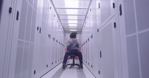 IT engineer or data science specialist working on tablet computer in server room Vídeos de archivo 219544744