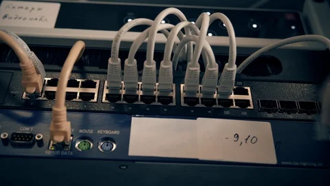 IT Engineer Patching Network Equipment In Server Room. 動画素材 104178407