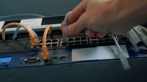IT Engineer Patching Network Equipment In Server Room. 動画素材 104178438