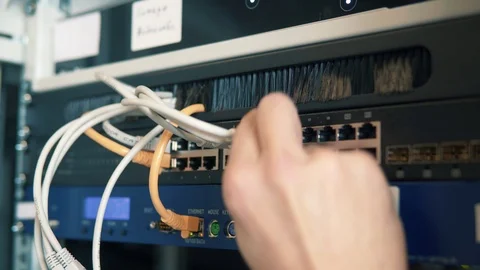 IT Engineer Patching Network Equipment In Server Room. 動画素材 104178572