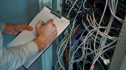 IT Engineer Patching Network Equipment In Server Room. 動画素材 104178574