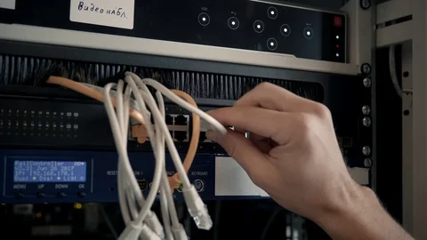 IT Engineer Patching Network Equipment In Server Room. 動画素材 104178602