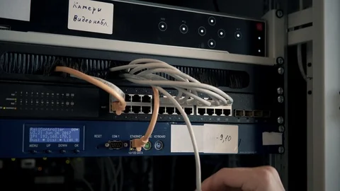 IT Engineer Patching Network Equipment In Server Room. 動画素材 104178625