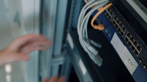 IT Engineer Patching Network Equipment In Server Room. 動画素材 104178911