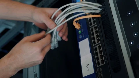 IT Engineer Patching Network Equipment In Server Room. Video stock 104179007