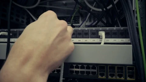IT Engineer Patching Network Equipment In Server Room. 库存影片 104180132